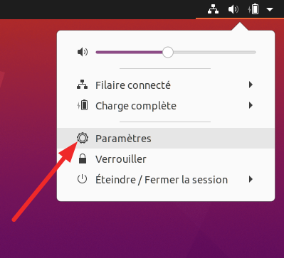 Capture d'écran pointant les «Paramètres» dans le tableau de bord (coin supérieur droit) de la première variante d'Ubuntu